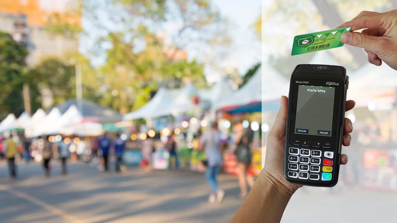 Blurred image of an event and payment at the card reader with a prepaid card