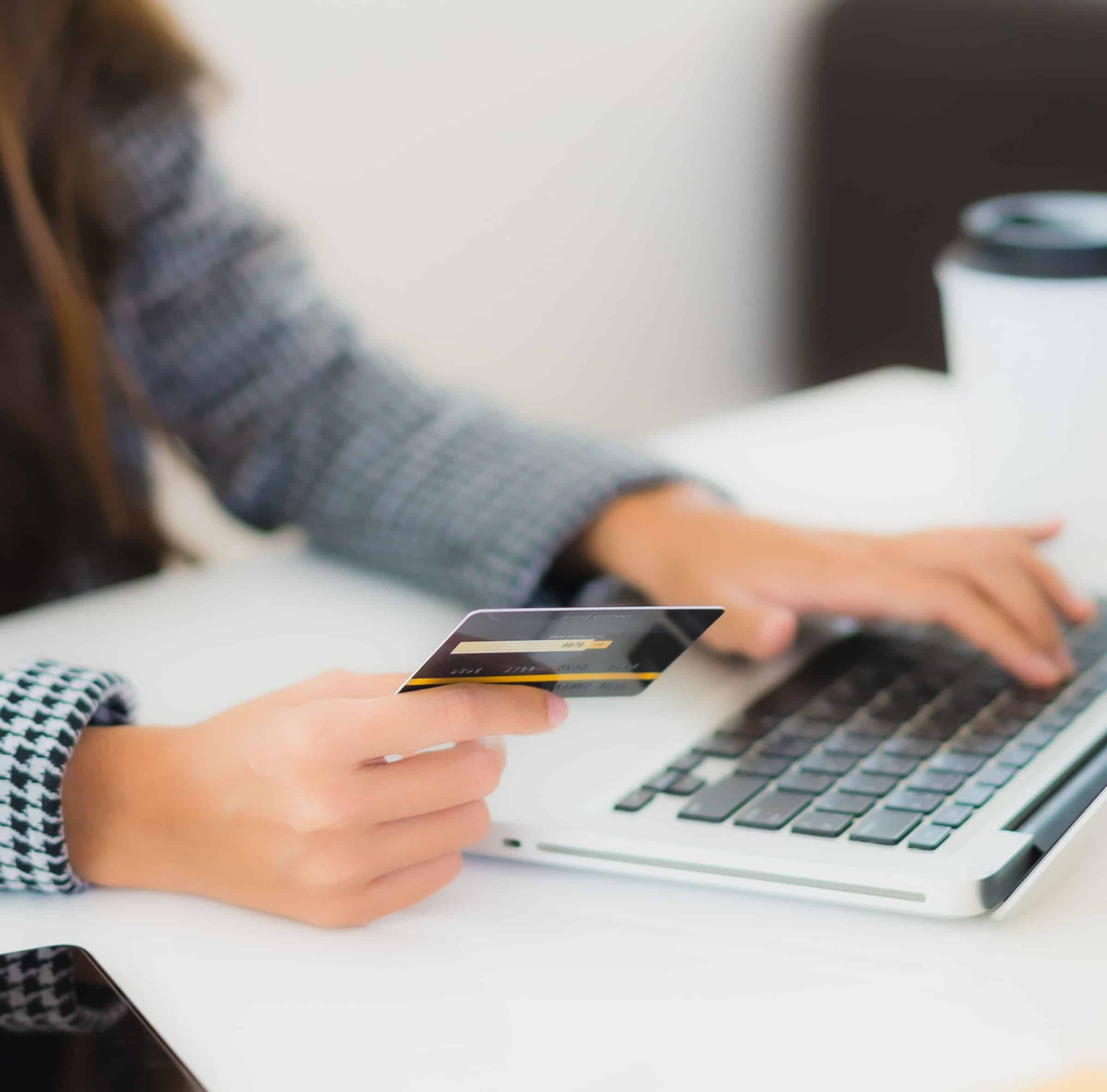 Portrait beautiful young asian woman use credit card with laptop